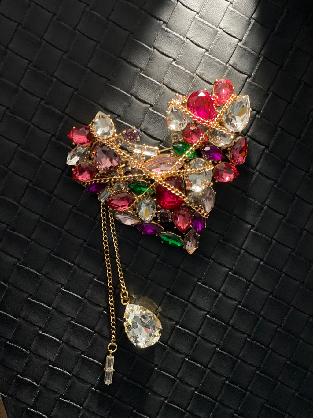Vintage-inspired heart brooch with multicoloured crystal embellishment, gold chain overlay and dangling crystal tassels.